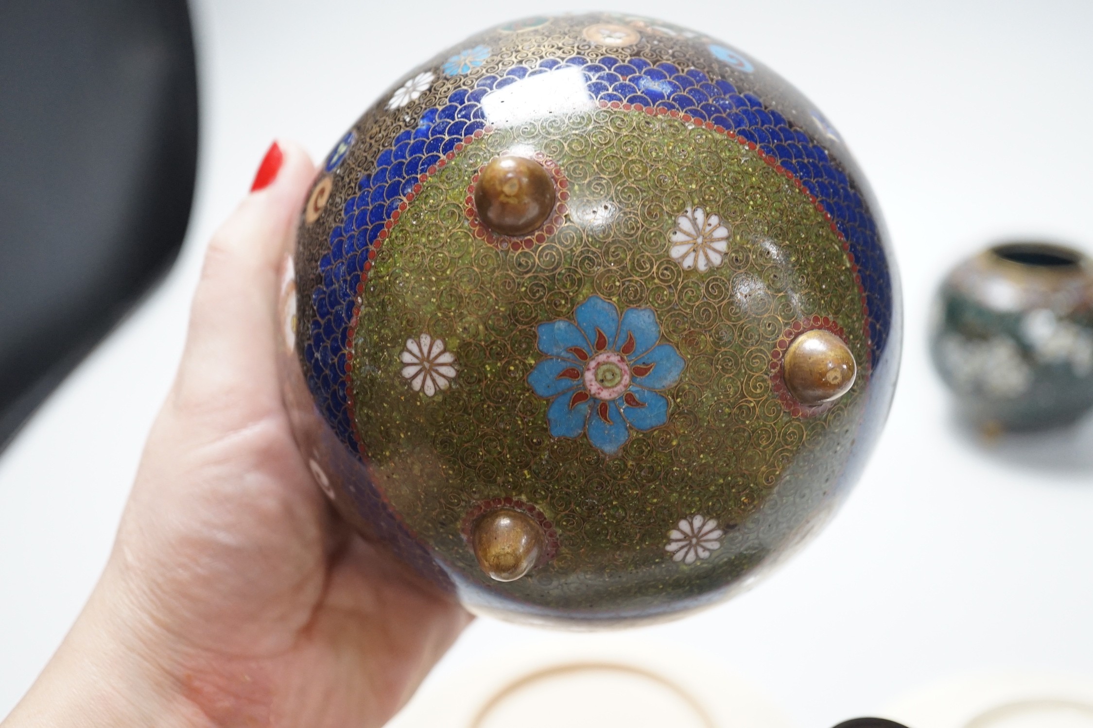 Three Japanese cloisonné enamel vases and two Satsuma saucers, Meiji period, tallest 12cm